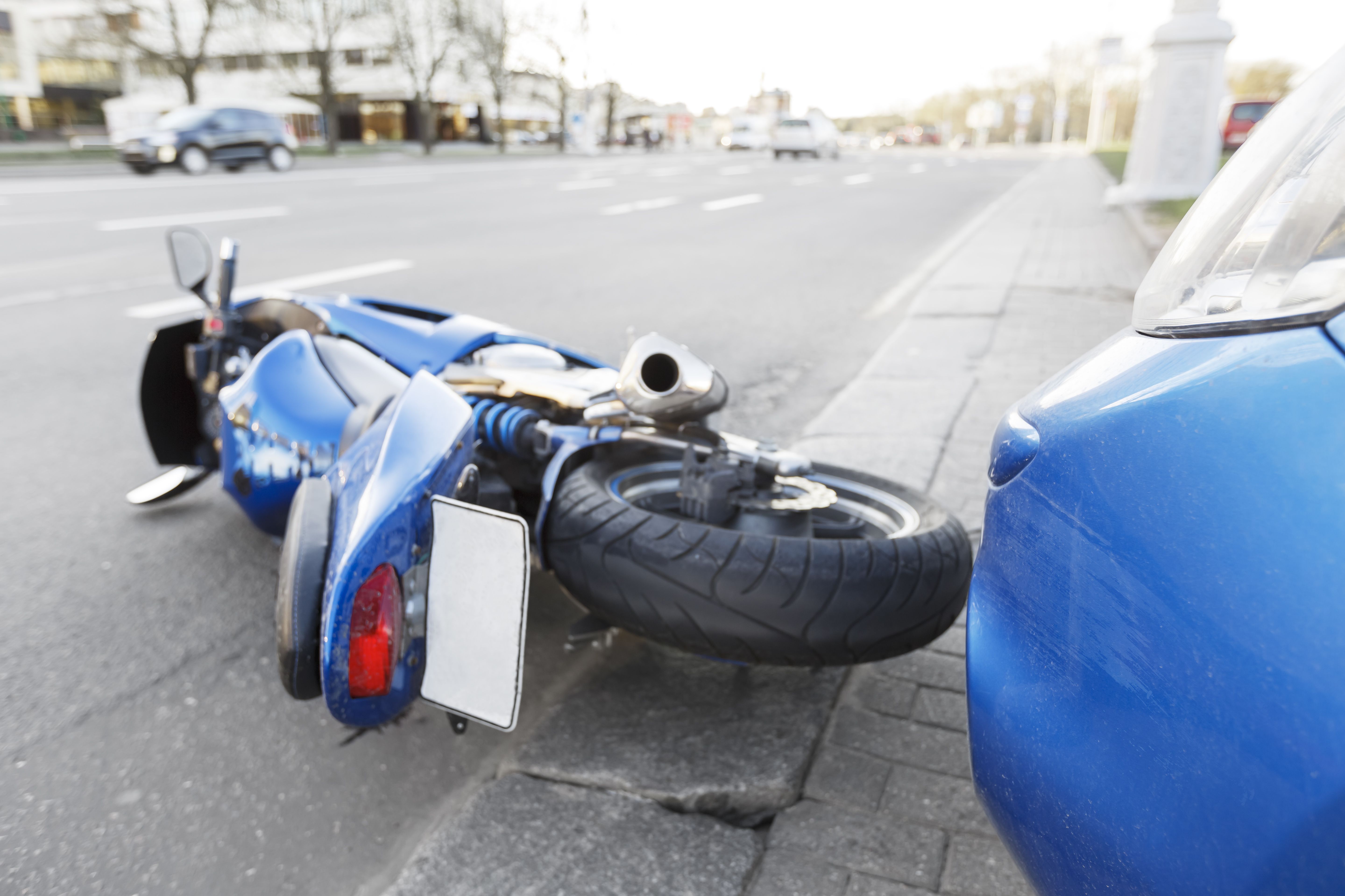 Motorcycle lying on the road after a motorcycle accident